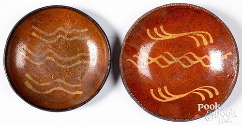 TWO PENNSYLVANIA REDWARE PLATES,