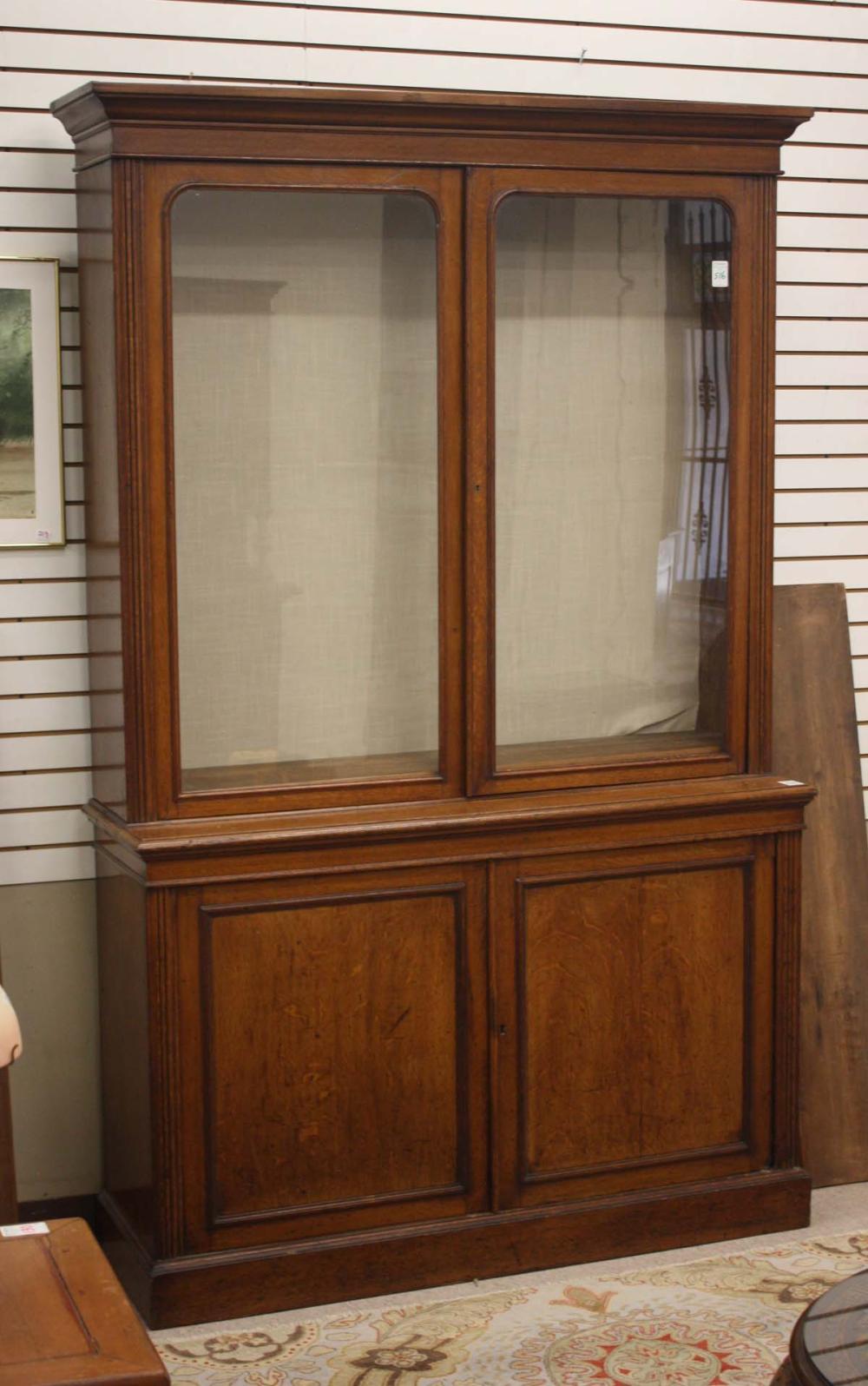 AN OAK CABINET BOOKCASE ON CABINET  315087