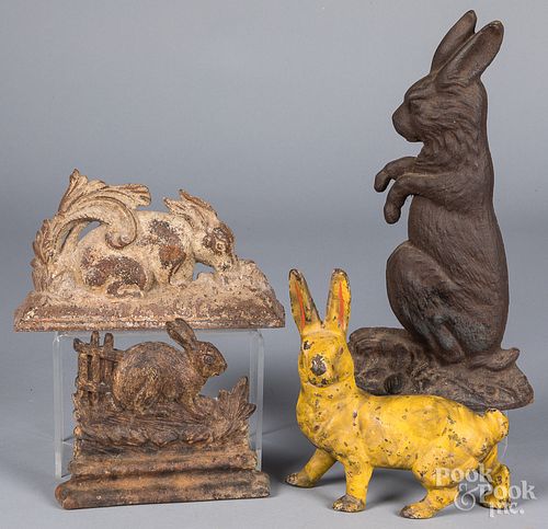 FOUR CAST IRON RABBIT DOORSTOPSFour