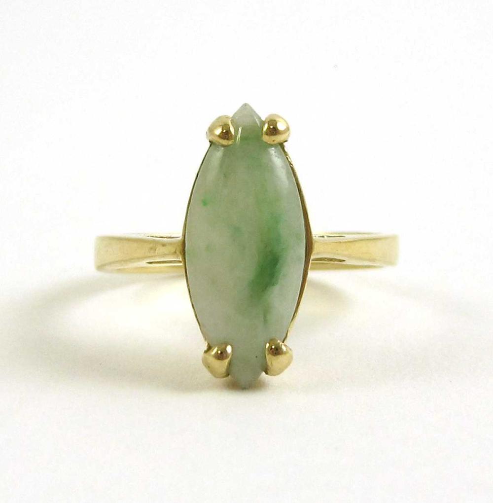 JADE AND FOURTEEN KARAT GOLD RING,