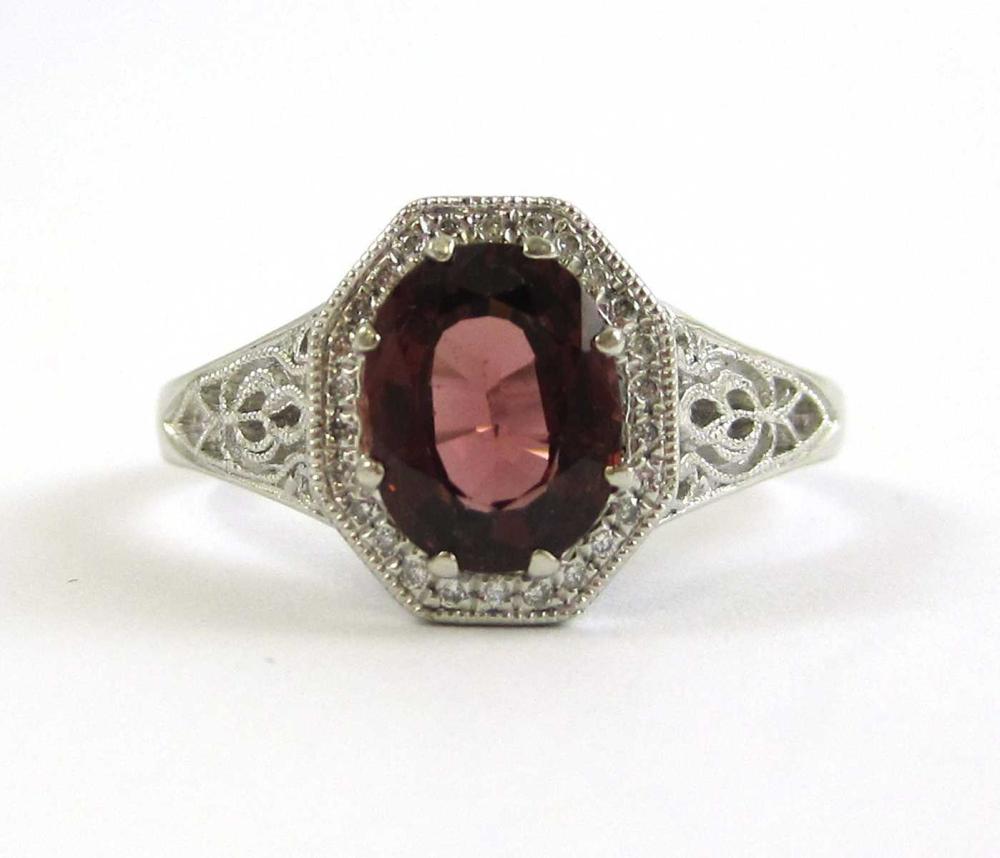 GARNET AND PLATINUM SOLITAIRE RING  315690