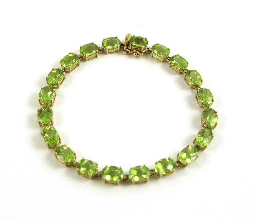 PERIDOT AND TEN KARAT GOLD TENNIS 315800