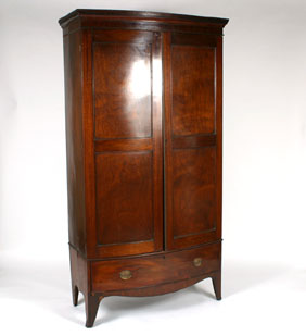 Mahogany bow front wardrobe; footed