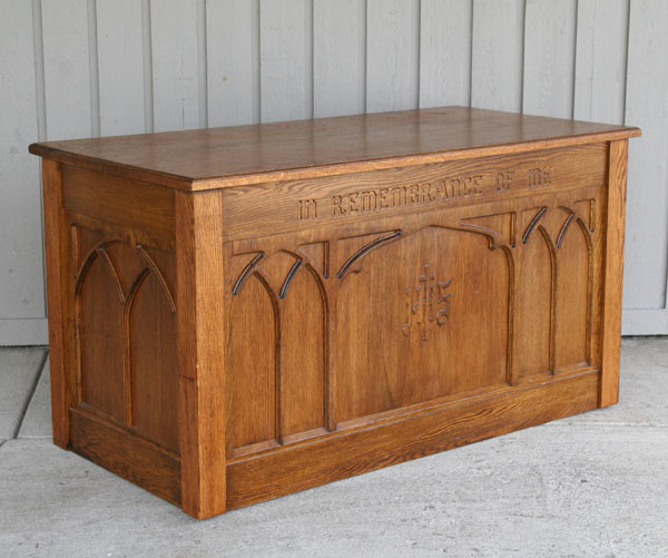 Oak communion table/cabinet; carved