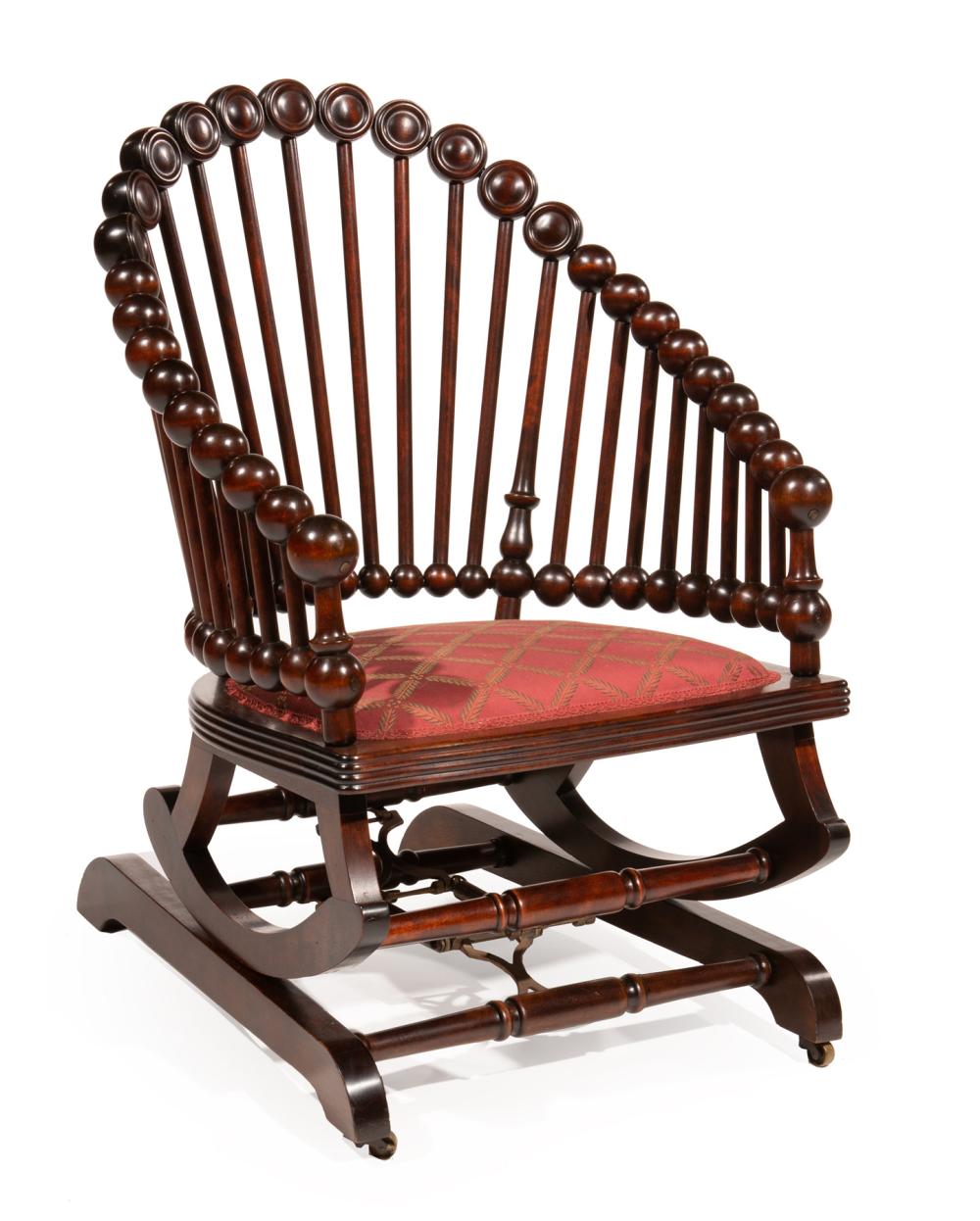 CARVED MAHOGANY ROCKING CHAIR,