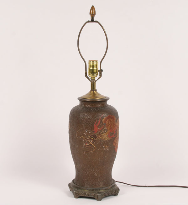 Asian bronze lamp; textured surface,