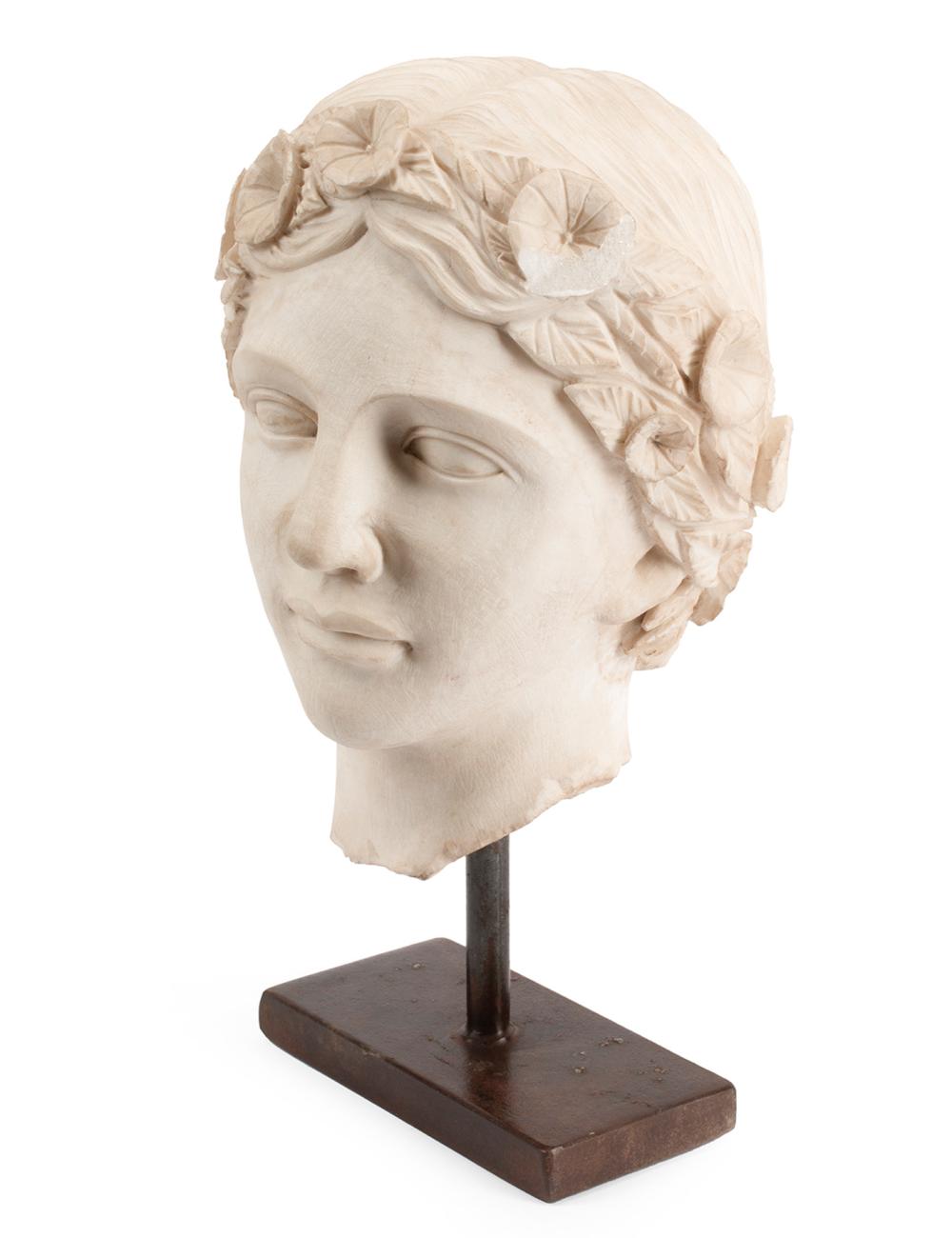 CARVED MARBLE HEAD OF A WOMANCarved