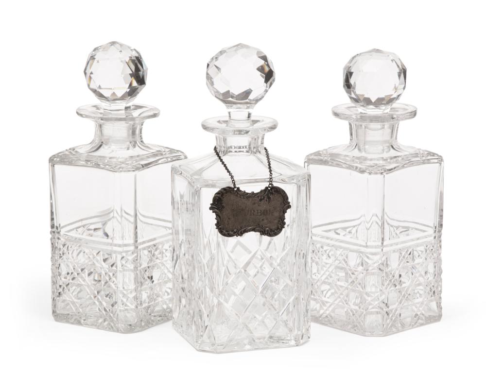 THREE CUT CRYSTAL DECANTERSThree