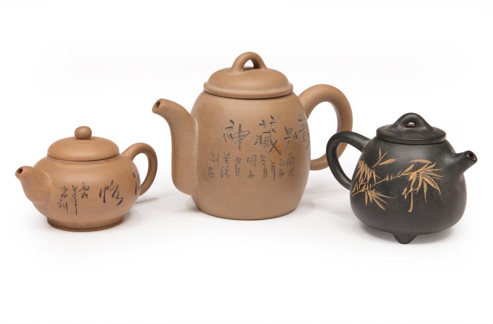 THREE CHINESE YIXING POTTERY TEAPOTSThree 3188b3