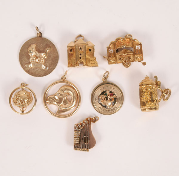 Lot of 8 pieces gold charms.  Three