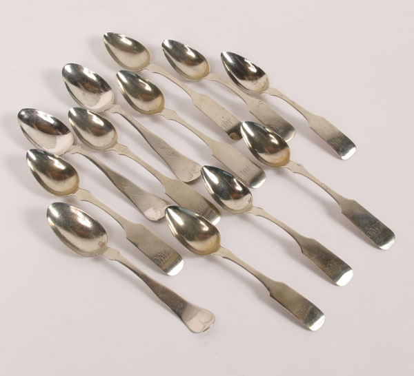 Twelve monogrammed coin silver spoons;