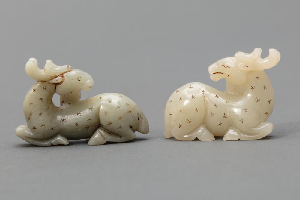 TWO CHINESE CELADON JADE RECUMBENT