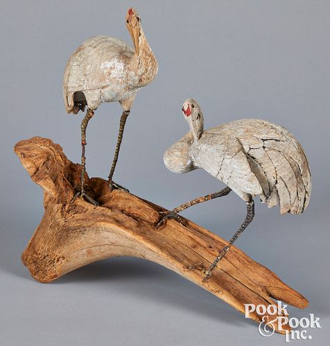 TWO CARVED AND PAINTED EGRETS ON