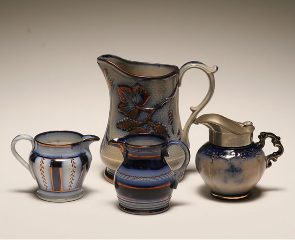Flow blue pitcher and creamers,