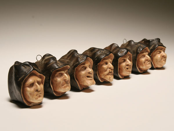 Plaster hooded monks heads hanging 4f30d