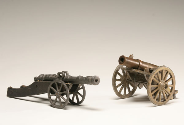 Two toy cannons; brass field artillery