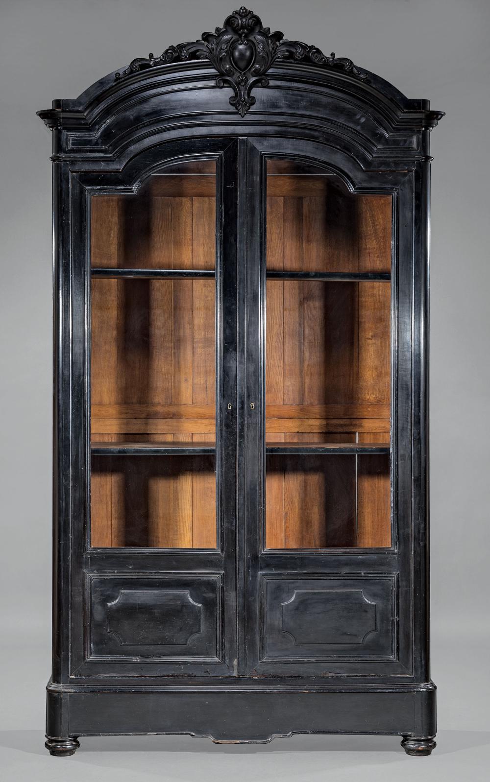 AMERICAN CARVED AND EBONIZED BOOKCASEAmerican