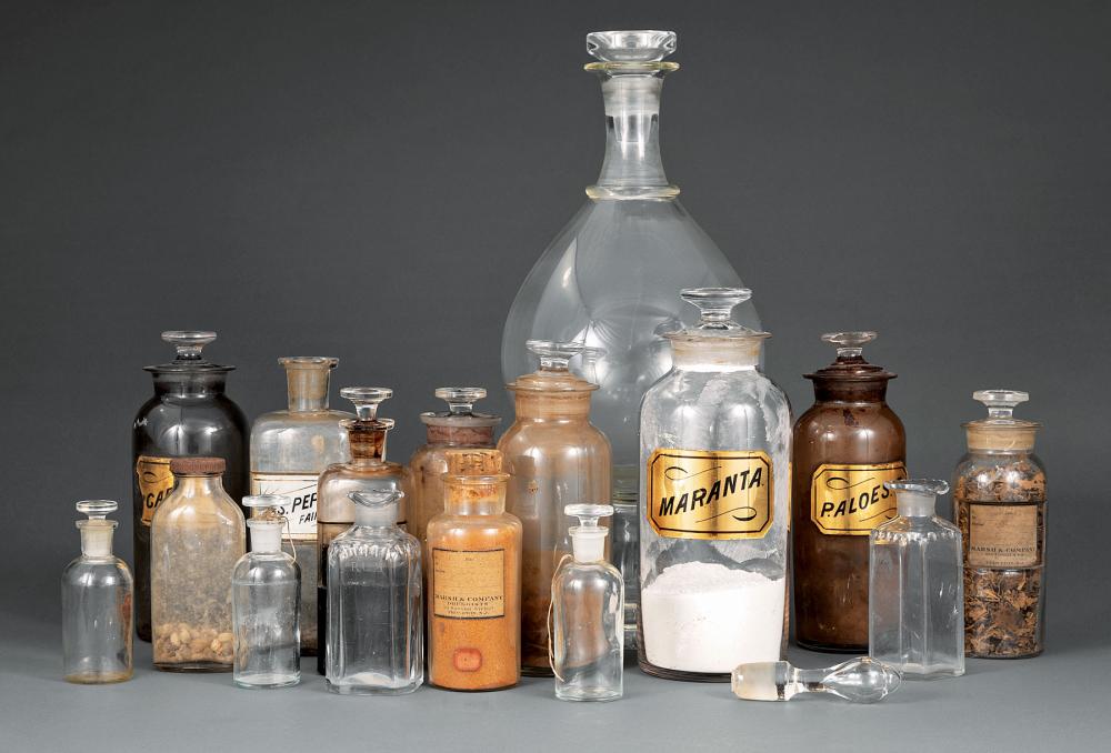 SIXTEEN GLASS APOTHECARY JARS AND