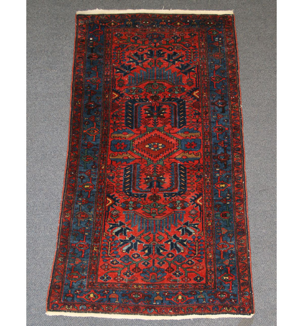 Hand loomed Oriental rug. 79" x