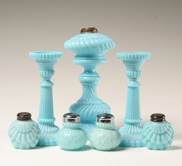 Seven blue milk glass items; swirl pattern