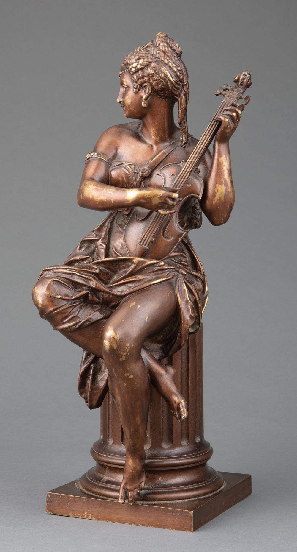 BRONZE FIGURE OF A WOMAN PLAYING