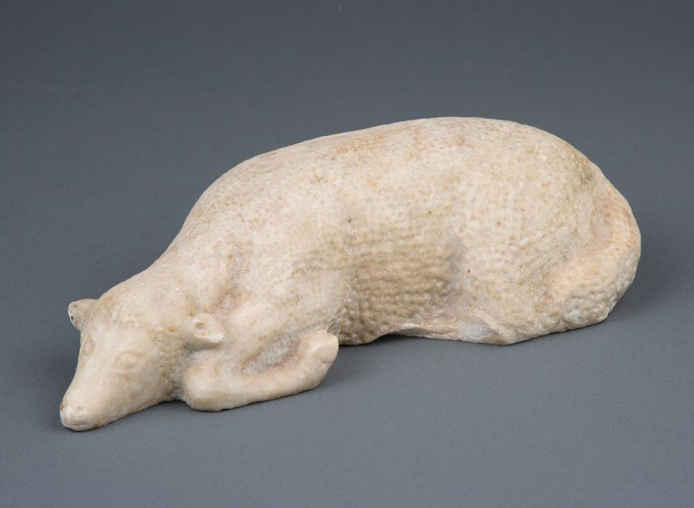 CARVED MARBLE FIGURE OF RECUMBENT