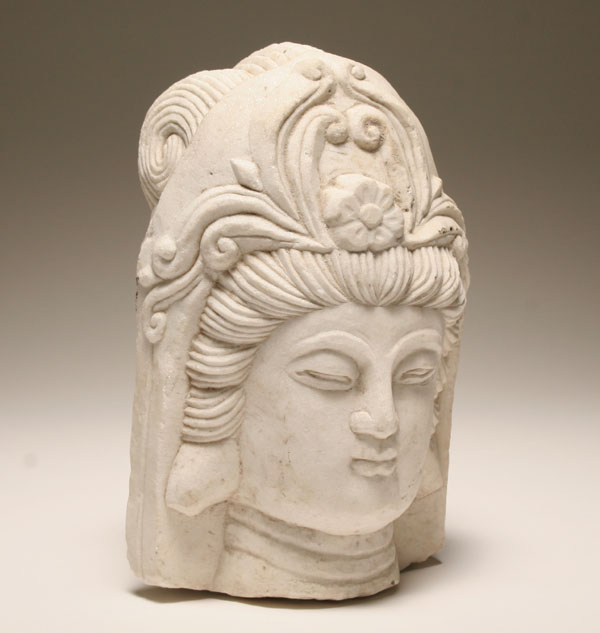 Carved marble bust of a Hindu deity;