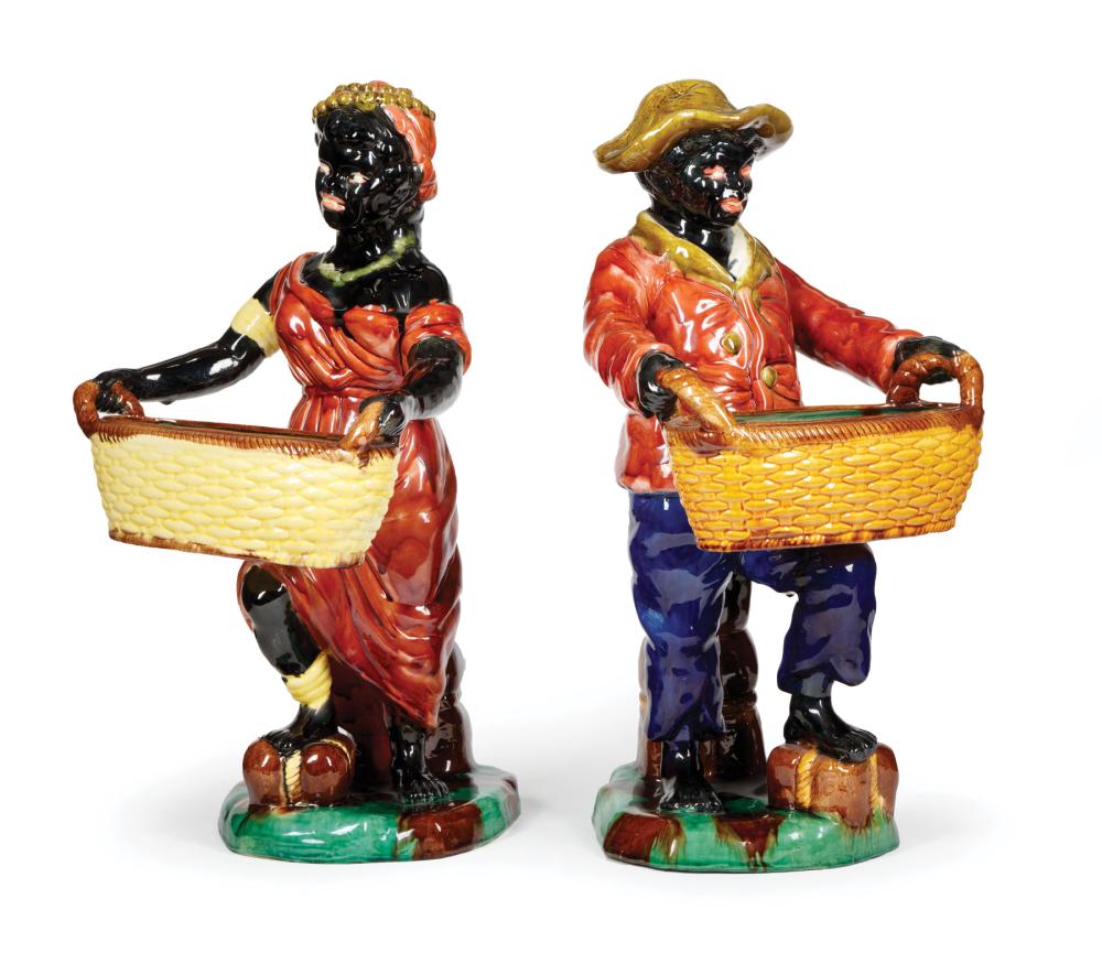 CONTINENTAL MAJOLICA FIGURES HOLDING