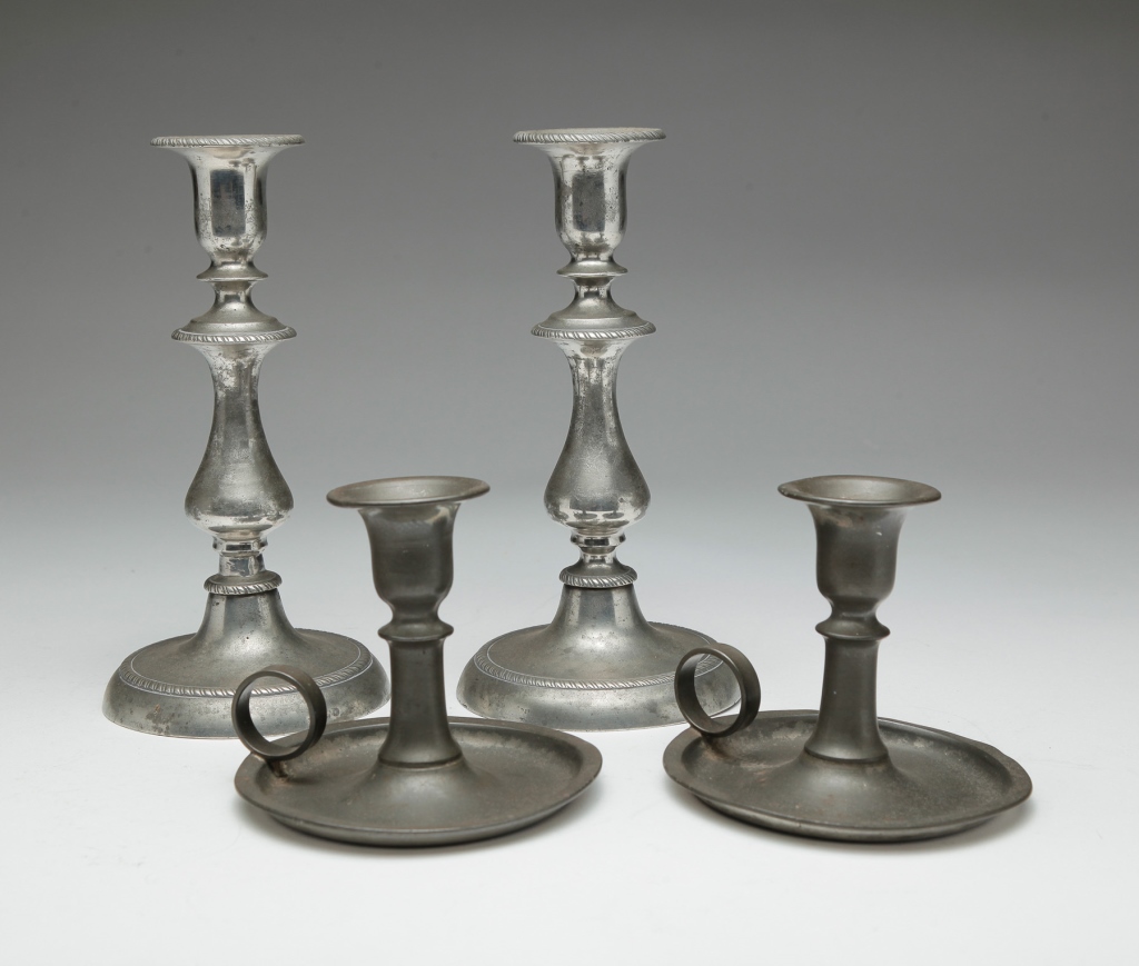 FOUR AMERICAN PEWTER CANDLESTICKS.