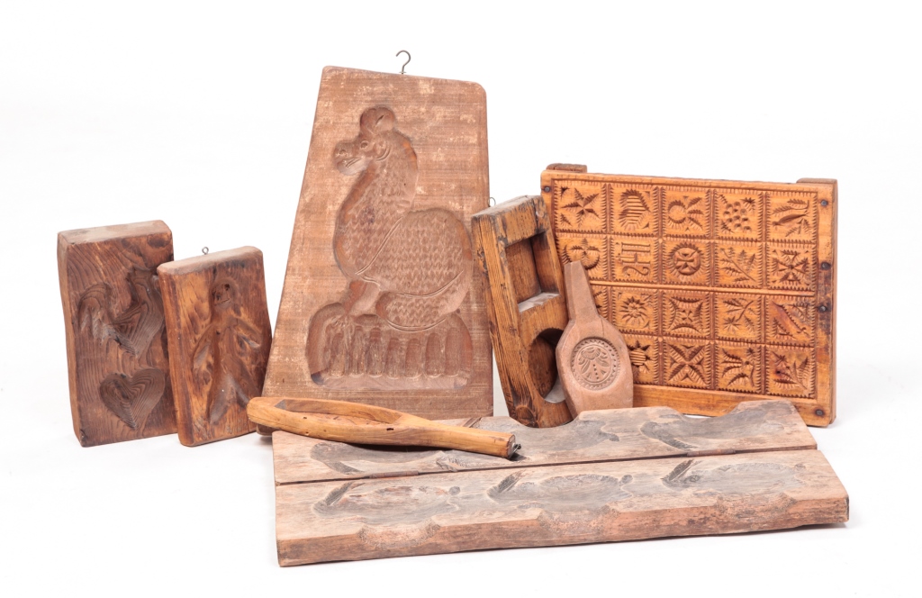 EIGHT WOODEN MOLDS. Late 19th,