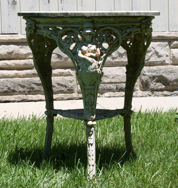 Victorian cast iron garden table; embossed