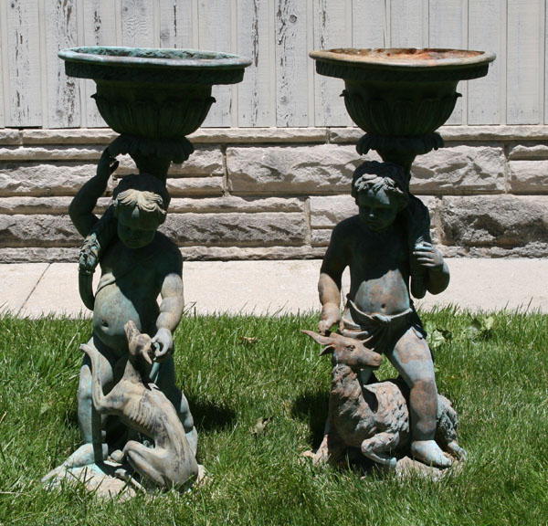 Cast metal urns; garden statuary with