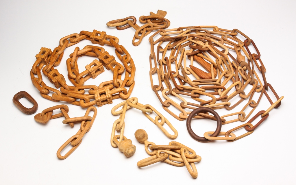 GROUP OF AMERICAN CARVED CHAINS.