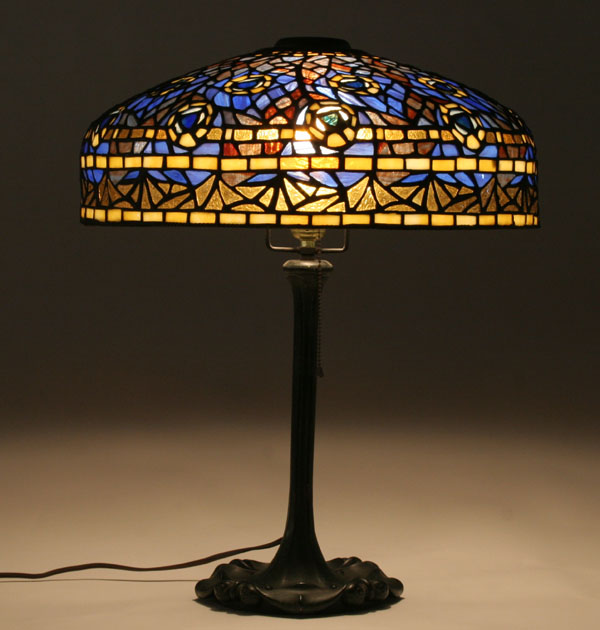 Leaded glass table lamp in peacock pattern.