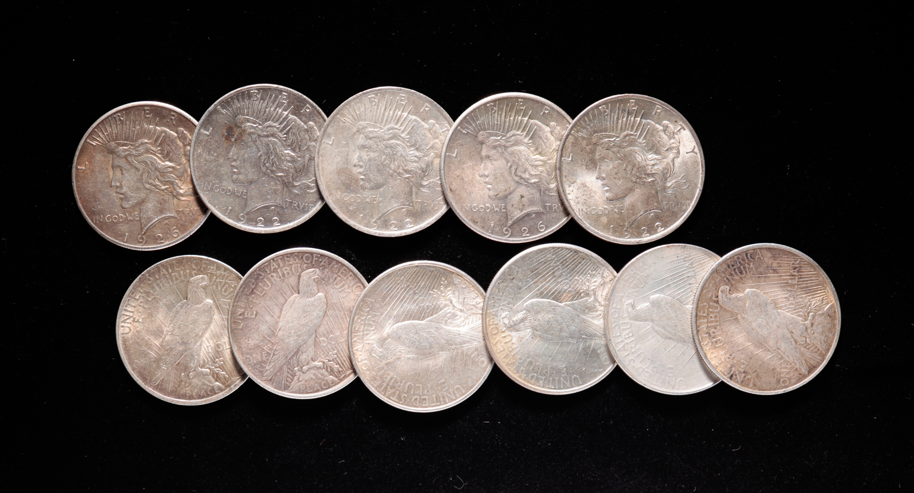 GROUP OF ELEVEN SILVER PEACE DOLLARS