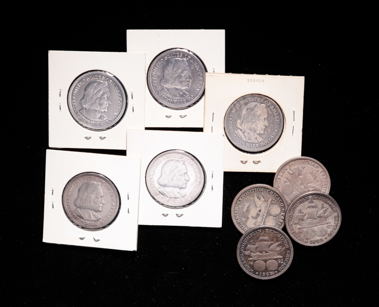 NINE SILVER COLUMBIAN HALF DOLLARS.