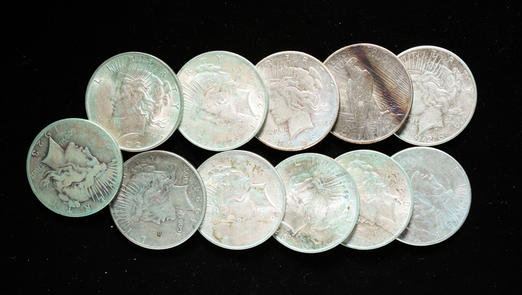 GROUP OF ELEVEN SILVER PEACE DOLLARS 31a1fc
