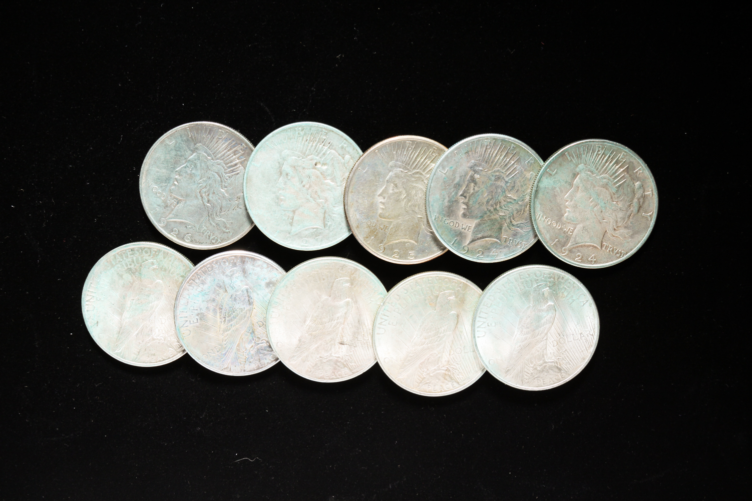 GROUP OF TEN SILVER PEACE DOLLARS