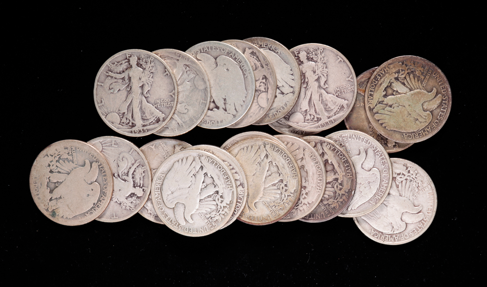 TWENTY SILVER WALKING LIBERTY HALF DOLLARS.