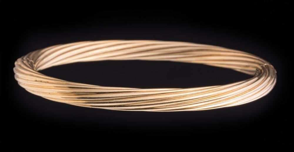 18 KT. YELLOW GOLD "TWIST" BANGLE