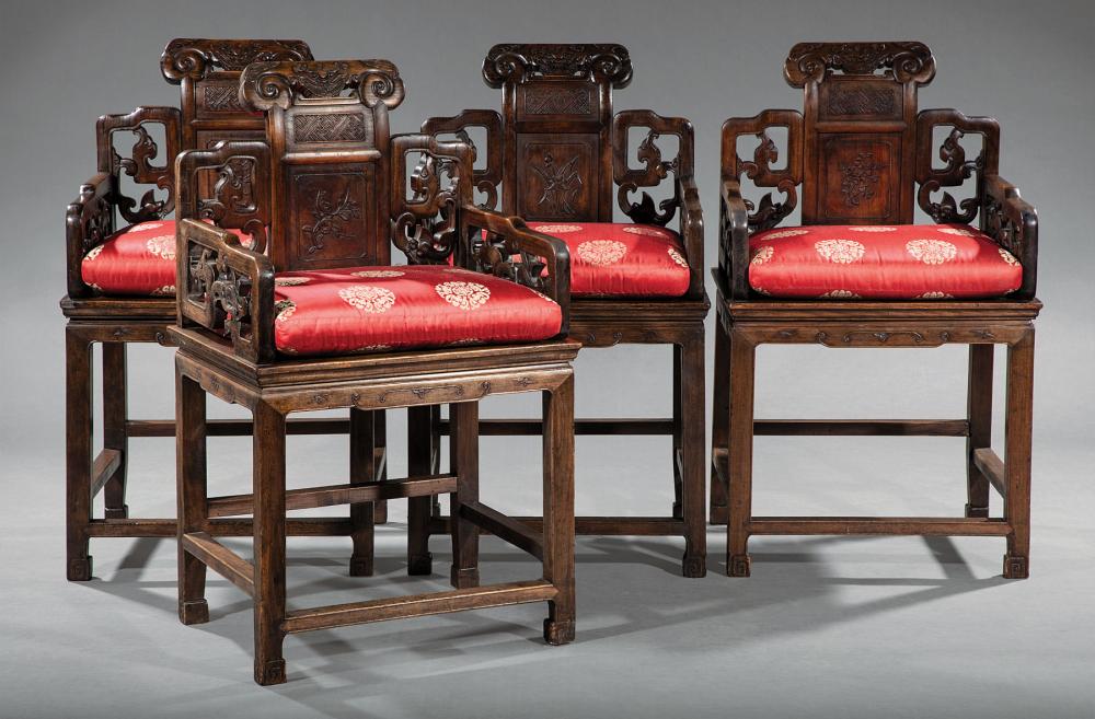 FOUR CHINESE CARVED HARDWOOD ARMCHAIRSFour