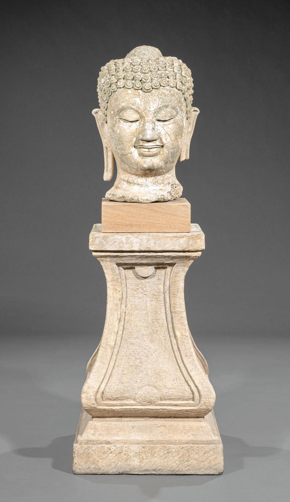 SOUTH ASIAN CARVED STONE OR STUCCO HEAD