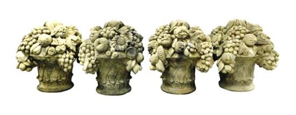 GARDEN: FOUR CEMENT FRUIT BASKET SCULPTURES,