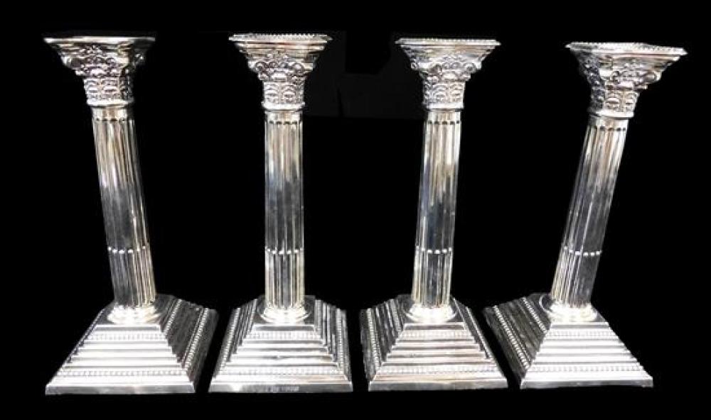 STERLING SET OF FOUR CANDLESTICKS  31d1aa