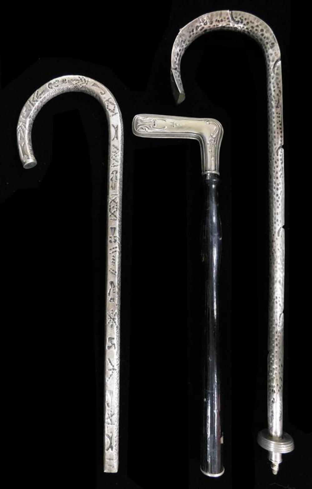 SILVER: THREE SILVER PARASOL HANDLES,