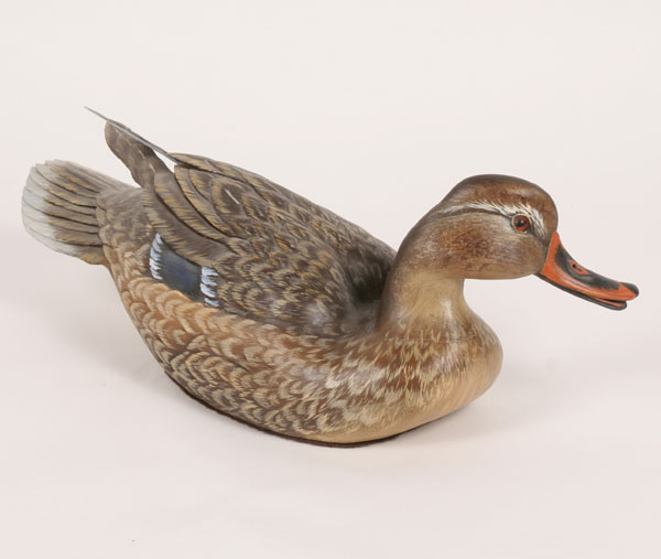 Artist duck decoy with reticulated carved