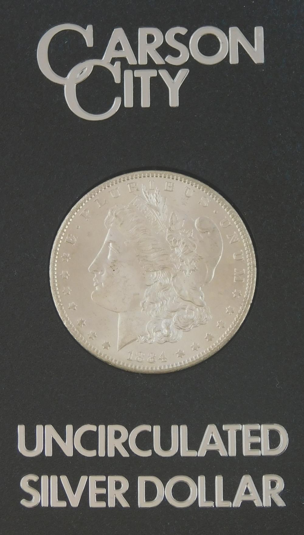 COINS: ONE 1884-CC SILVER DOLLAR,