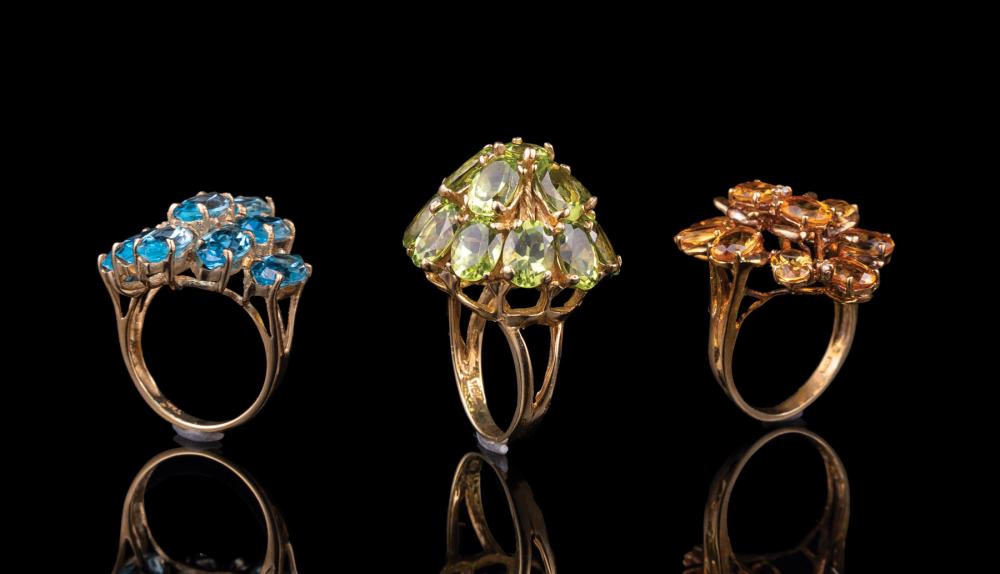 THREE YELLOW GOLD AND GEMSET CLUSTER