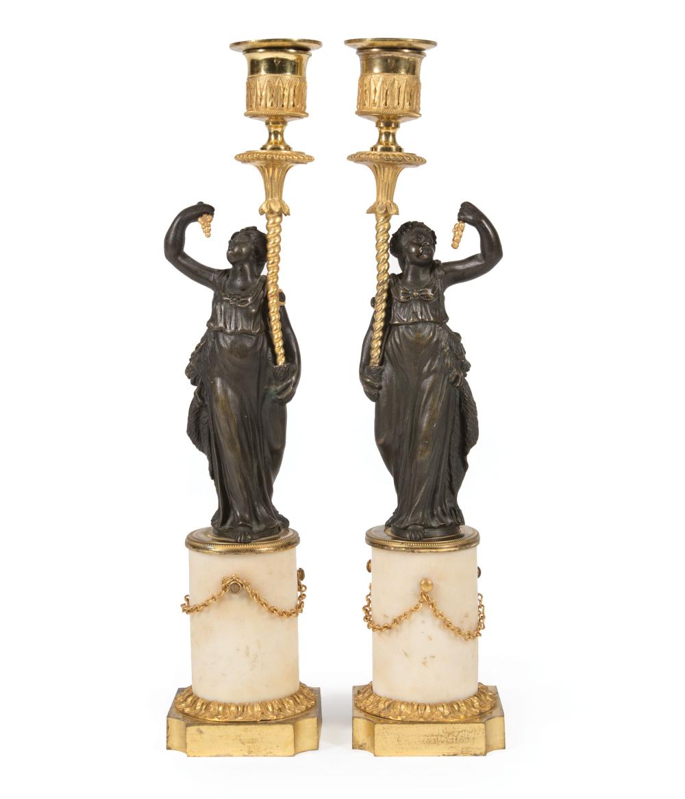 GILT AND PATINATED BRONZE FIGURAL CANDLESTICKSPair