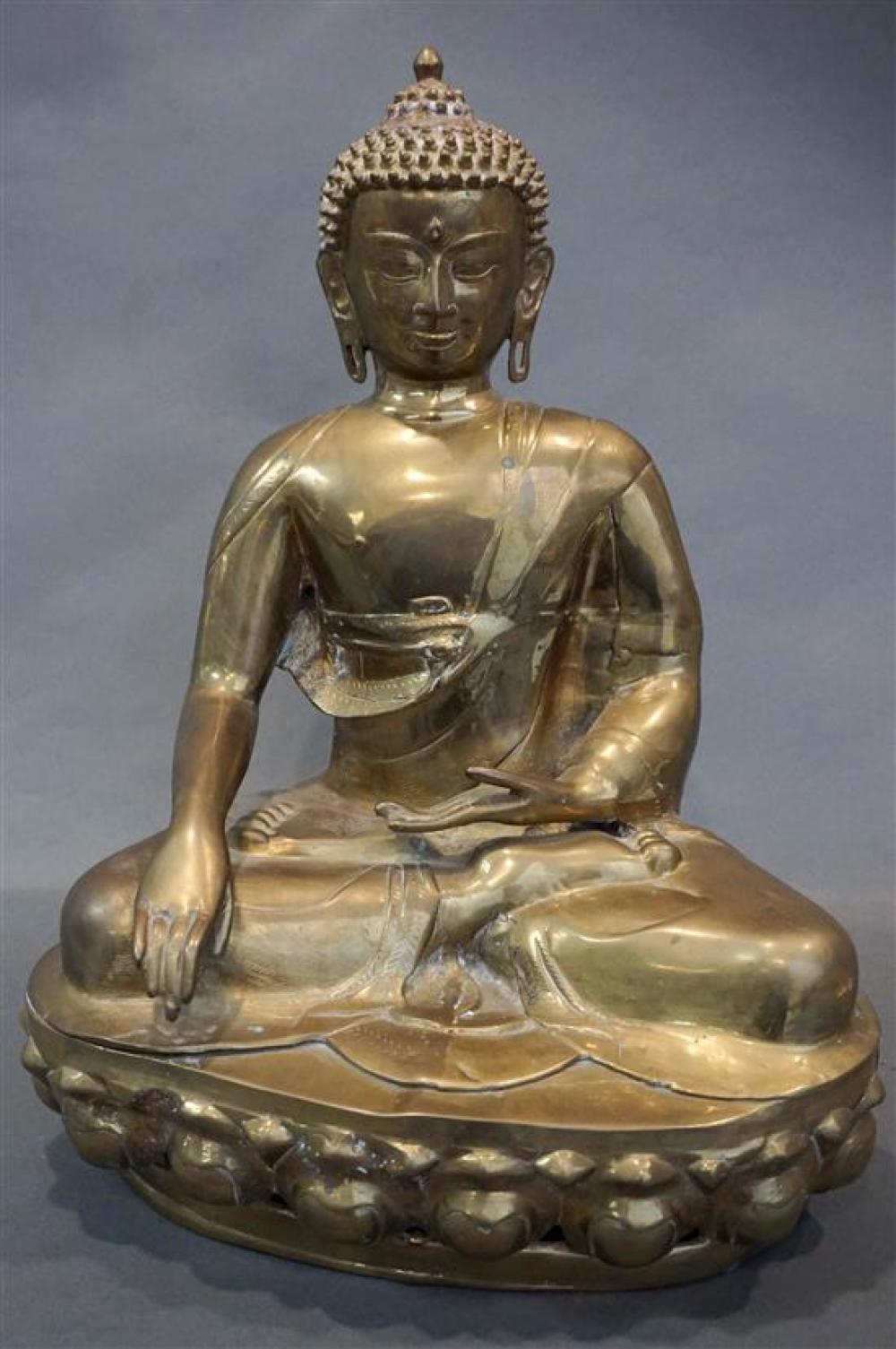 BRASS FIGURE OF A SEATED BUDDHABrass